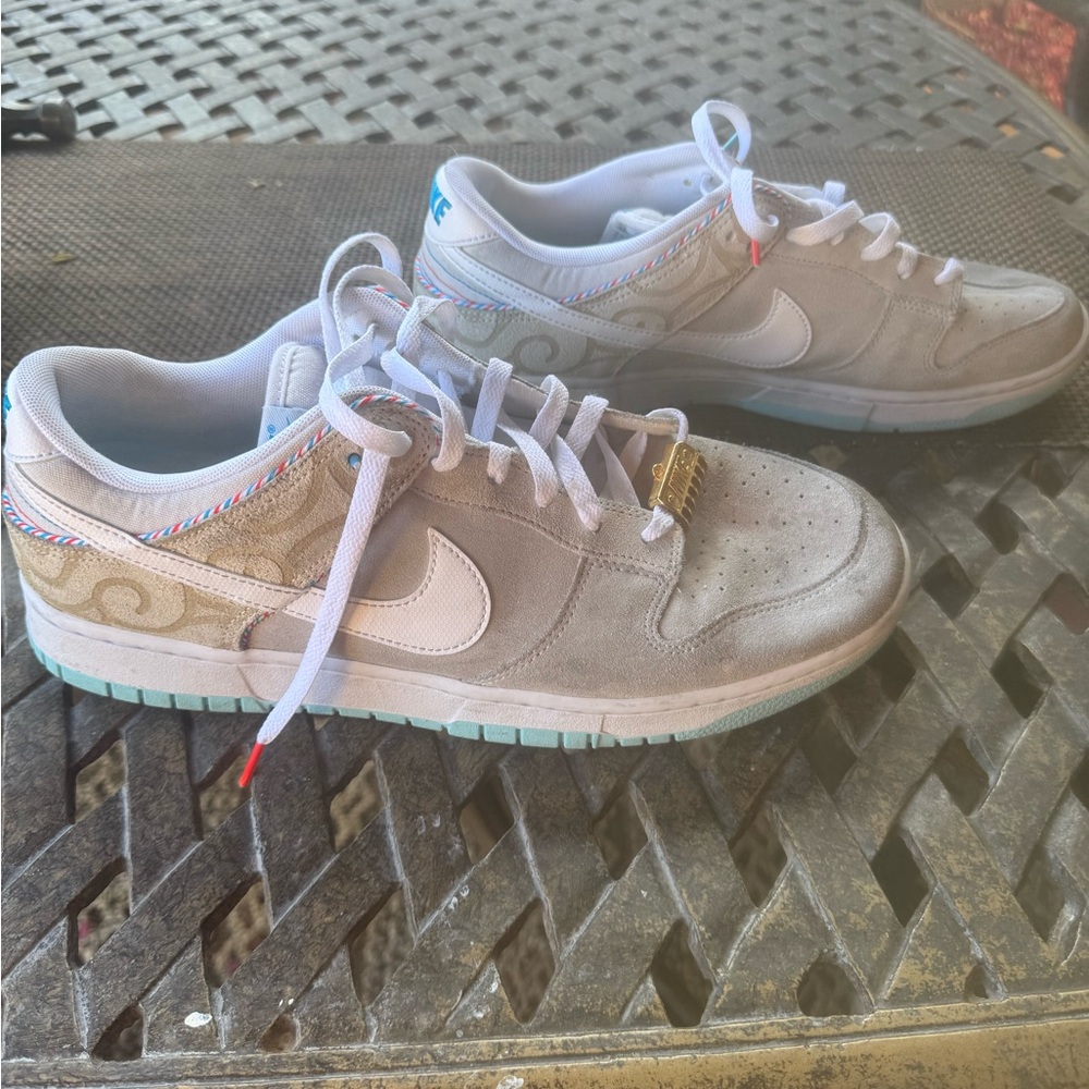 Nike Dunk Low in light gray, white and aqua accents